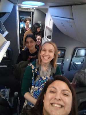 students smiling on flight